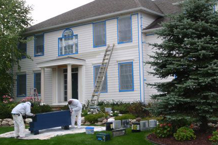 Heritage Home being painted by crew