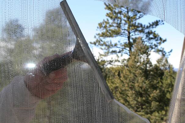 window being washed by hand 