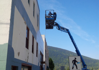 Painting the Delux Paints Building